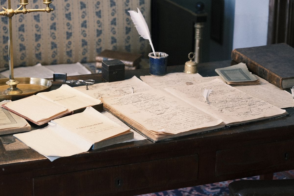 Cozy study desk with an open book and papers